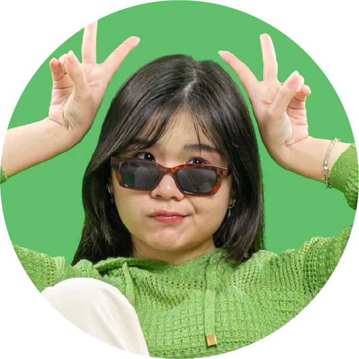 a woman wearing sunglasses making a peace sign